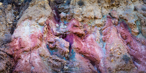 Close up of colorful volcanic rocks in the vicinity of the Negratin reservoir (Embalse de Negratin), Andalusia, Spain