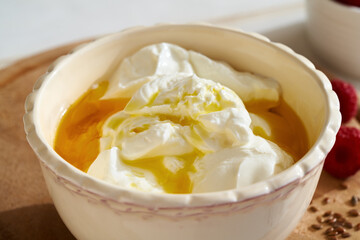 Cottage cheese with flax seed oil in a bowl. Budwig diet.