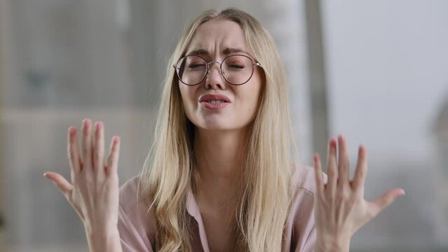 Portrait frustrated stressed business woman caucasian girl blond desperate grief crying suffers offended lady problem takes off glasses blows nose in paper napkin sadness loss failure breakup divorce