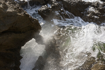 water flowing over rocks in the coast