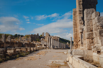 Agora columns with great sky viewin Perge or Perga ancient Greek city - once capital of Pamphylia in Antalya Turkey on warm October afternoon.