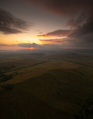Landscapes in Transylvania. Aerial panoramic view of a beautiful sunset over the hills from Harghita County in Romania.
