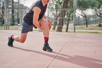 Banner of a sportsman with a basketball on a neighborhood court practicing dribbling.