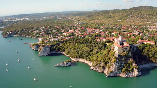 4K aerial - a bird's eye view&nbsp;video (Ultra High Definition) of Duino Castle. Picturesque morning scene of Adriatic coast of Italy, Europe. Beautiful summer scenery. Traveling concept background..