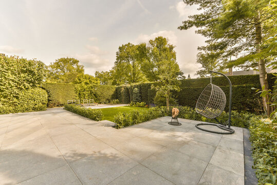 Wicker swing chair on backyard