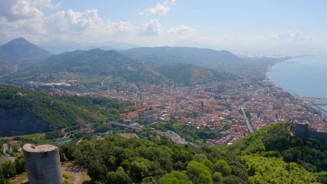 4k drone flight back footage (Ultra High Definition) of Bastiglia tower and Arechi Castle. Picturesque morning cityscape of Salerno town, Italy, Europe. Traveling concept background..