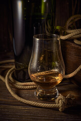 Glencairn whisky glass on a wooden background