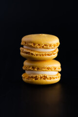 Bakery Still Life on Black Background. Pastel Macarons. Isolated Macarons. Two Lemon Macarons Stack on Black Background.