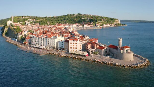 4k drone flight moving to the side footage (Ultra High Definition) of Piran town. Stunning summer scene of Slovenia&rsquo;s Adriatic coast with beautiful Venetian architecture..