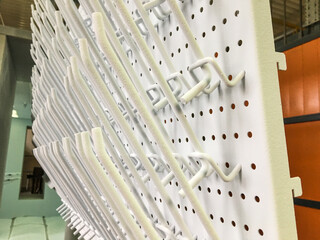 Powder coating line. Metal panels are suspended on an overhead conveyor line. Painting products in...