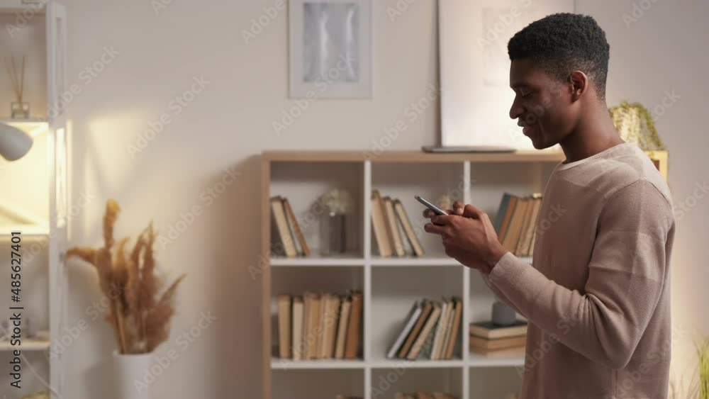 Wall mural mobile network. digital communication. gadget leisure. happy millennial man texting online chat mess