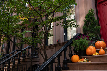 New York City Brownstone Home Decorated with Pumpkins on the Stairs during Autumn