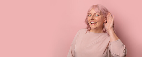 Shock, gossip, share advice. Young 30s woman smiling with hand over ear listening and hearing to...