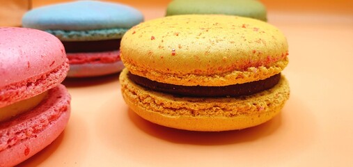 Cakes macaroons. Cookies macaroons. Bright tasty cakes. Multicolored cakes and cookies. Sweet background.