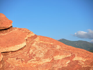 Red-orange rocks pushed up during the glacial and earthquakes beginnings in the Rocky Mountains