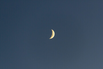 Obraz na płótnie Canvas Crescent moon on the dark night sky. High quality photo