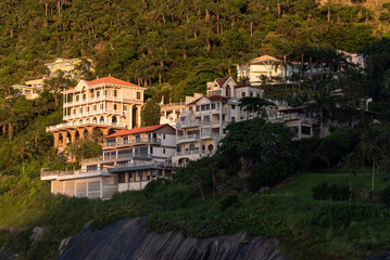 Fototapeta na wymiar Beautiful view to rich houses on beach rainforest hill side