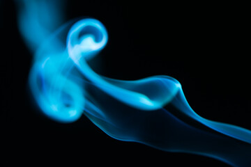 beautiful blue puffs from cigarette smoke
