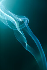 beautiful blue puffs from cigarette smoke