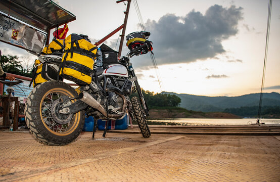 scrambler type motorbike on ferry in the north of  Thailand