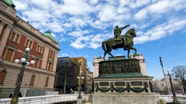  Monument of Prince Mihailo, located in the main Republic Square in Belgrade, Serbia.Beautiful blue sky with puffy clouds in background.