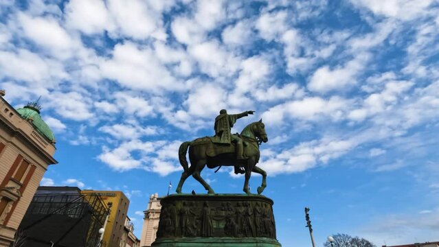  Monument of Prince Mihailo, located in the main Republic Square in Belgrade, Serbia.Beautiful blue sky with puffy clouds in background.