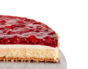 Slice of Red fruit sponge cake on plate.