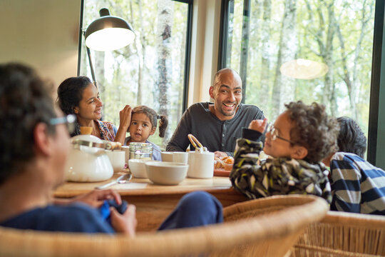 Happy family eating at dining table
