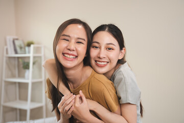 two happy women lesbian couple living together