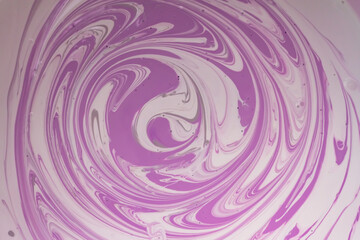 Streaks of purple and white paint when mixing different colors to get a shade. Background