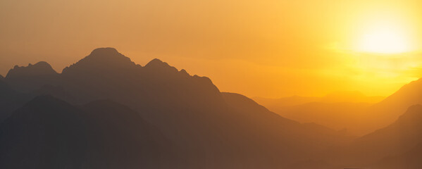 natural landscape - misty mountains at sunset