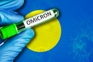 Palau outbreak of omicron variant. Hand holds a test tube with covid-19 virus omicron in front of...