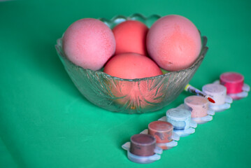 Four eggs for coloring , preparation for Easter holiday. Easter tradition to color eggs