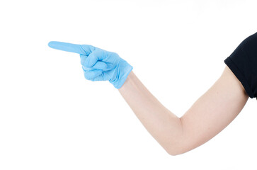 Hand pointing this way to follow. Hand in a disposable latex blue glove. Woman's hand gesture or sign isolated on white background. Hand touching or pointing to something. Copy space. 2019-nCoV. Close