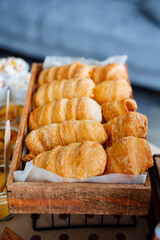 Fresh pastries. Sweet crispy buns in the bakery window. Croissants with different fillings. Yeast dough desserts