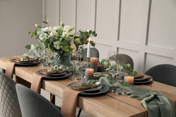 Festive table setting with beautiful floral decor indoors