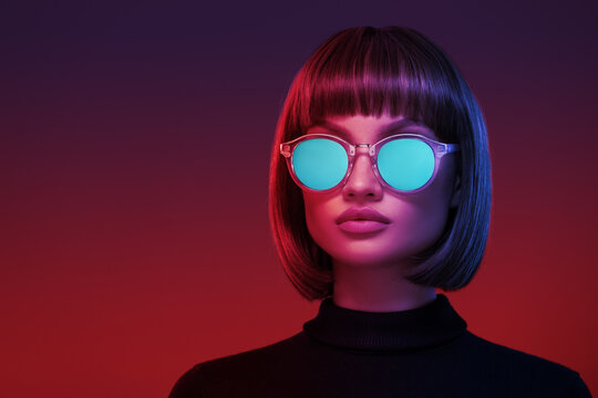 Portrait of a girl in neon light. Blue cyberpunk sunglasses.