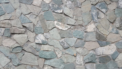 Flagstone in the form of a combination of various gray stone slabs background