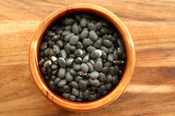 Black beans in a wooden bowl