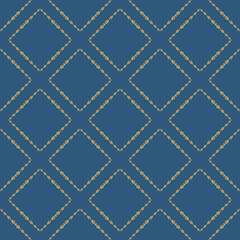 Golden ornament on a blue background. Floral rhombuses. Vector seamless pattern.