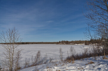 Frozen Astotin Lake on a Partially Cloudy Winter Day