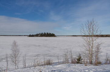 Frozen Astotin Lake on a Partially Cloudy Winter Day