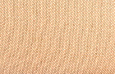 Fototapeta premium Dense fabric for furniture upholstery in light red, scarlet color. Texture. Material for a seamstress, tailor, fashion designer