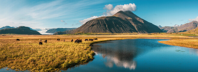 Beautiful, dramatic Iceland landscape with mountains reflections in a river, glacier and Icelandic...