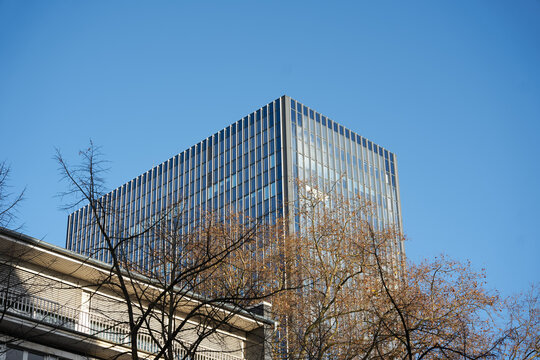 Business building on the bright autumn sky.