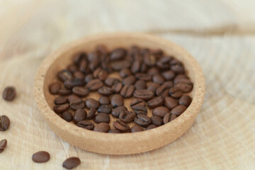 Cafe concept. Coffee beans on natural wooden table and background, trendy design background concept. Coffee business