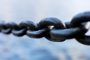 an iron chain. Close-up, the concept of strength, mutual assistance.