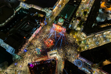 High aerial view of crowds gathering to watch the Christmas light in Victoria Square, Hull.