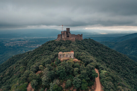 Aerial view of Castel de Montsoriu, a medieval and gothic stronghold on hilltop, Girona, Spain.