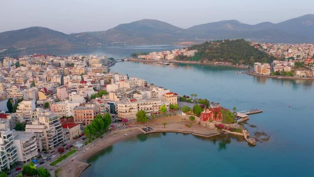 4K aerial - a bird's eye view&nbsp;video (Ultra High Definition) of Chalcis town. Stunning morning seascape of Aegean sea, North Euboean Gulf. Impressive summer scene of Euboea island, Greece, Europe.